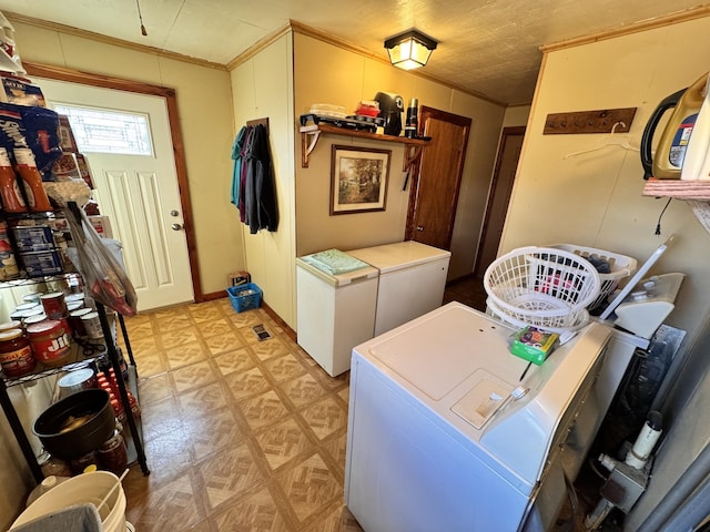 clothes washing area with washer and dryer