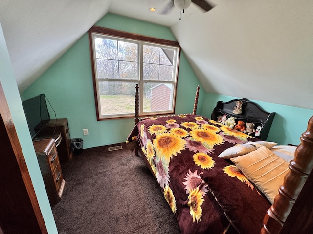 bedroom featuring dark colored carpet, ceiling fan, and lofted ceiling