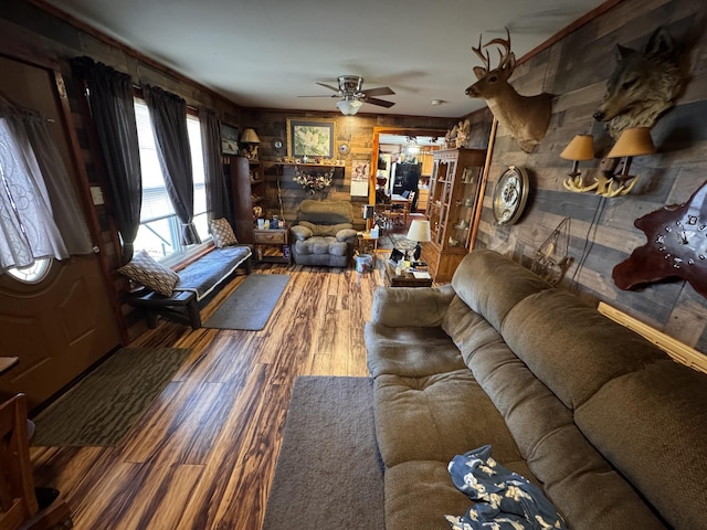 living room with wood-type flooring and ceiling fan