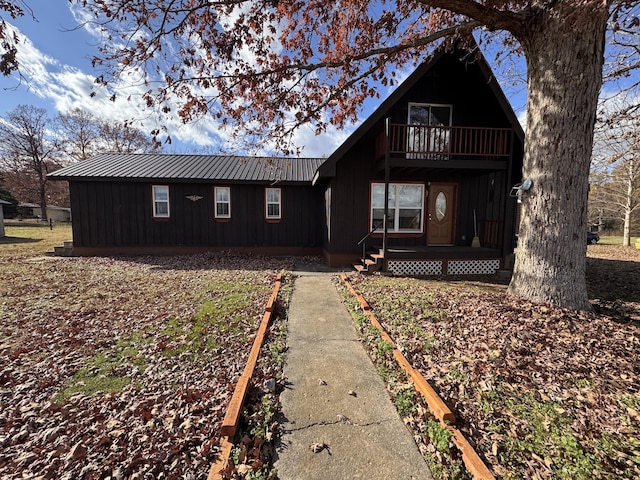 view of front of home with a balcony