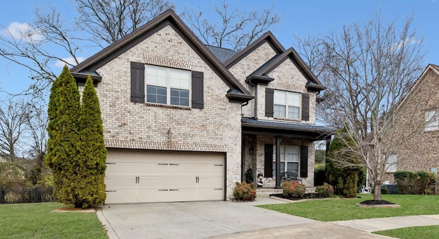 view of front of property featuring a garage and a front lawn