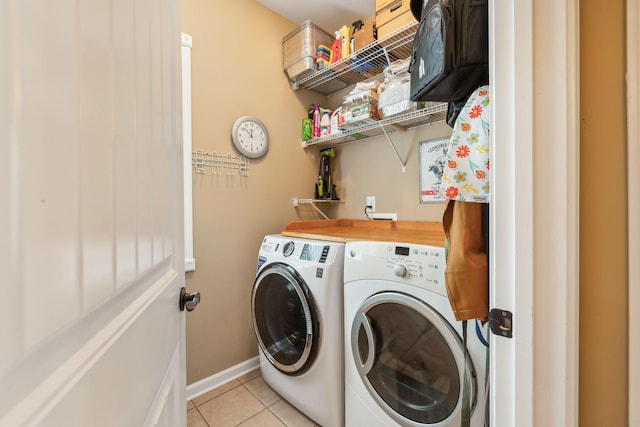 washroom featuring light tile patterned flooring and independent washer and dryer