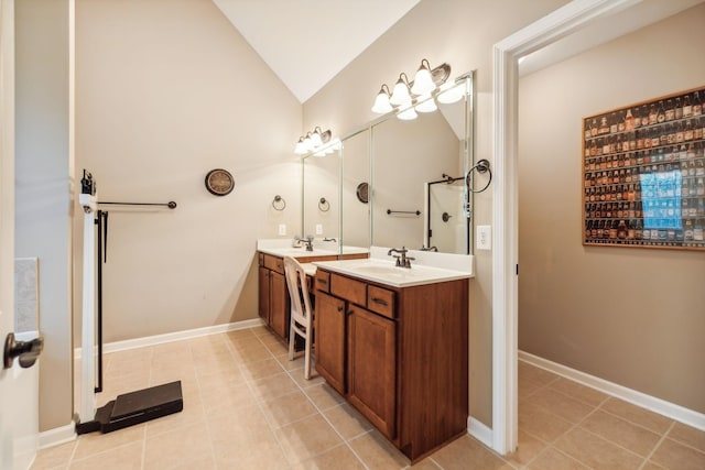 bathroom featuring tile patterned floors, vanity, and lofted ceiling