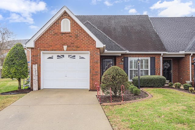 view of front of house featuring a garage and a front lawn