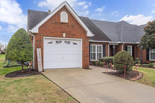 front of property with a front yard and a garage