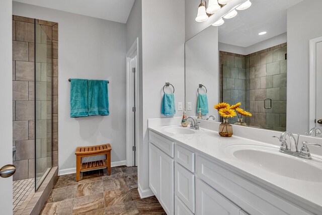 bathroom featuring vanity and a shower with shower door