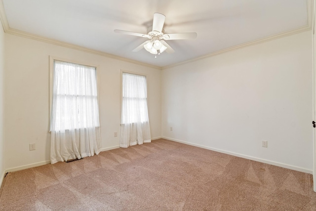 carpeted empty room featuring ceiling fan and ornamental molding