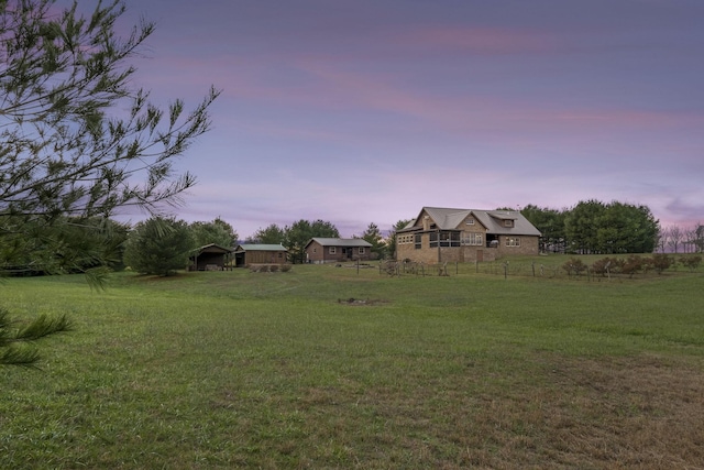 view of yard at dusk