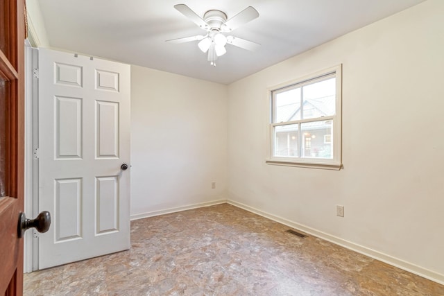 spare room featuring ceiling fan