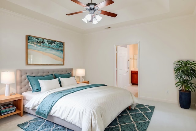 carpeted bedroom with ceiling fan, crown molding, and ensuite bathroom