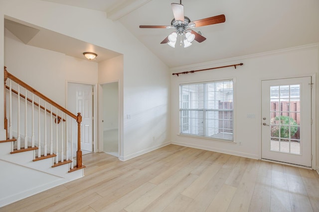 foyer entrance featuring ceiling fan, light hardwood / wood-style flooring, and lofted ceiling with beams