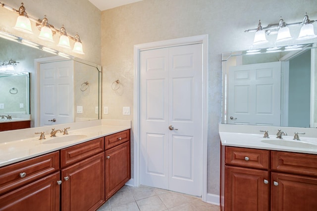 bathroom with tile patterned flooring and vanity