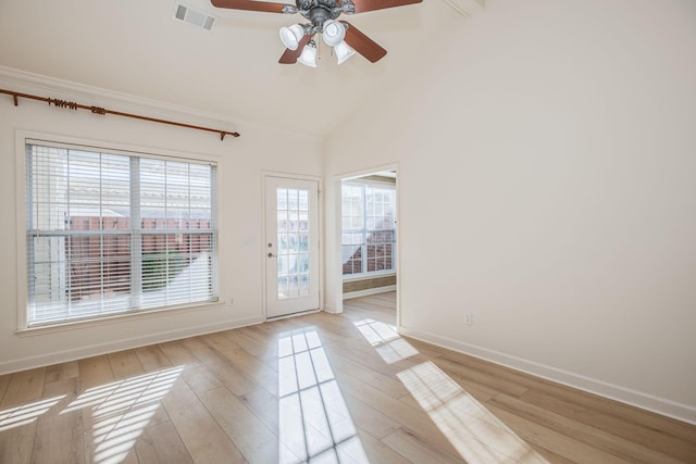 doorway to outside featuring ceiling fan, light wood-type flooring, and high vaulted ceiling