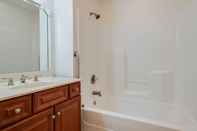 bathroom with shower / bathing tub combination and vanity