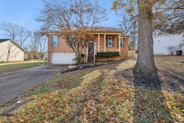 view of front of property with a porch and a garage