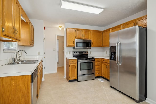 kitchen featuring appliances with stainless steel finishes and sink