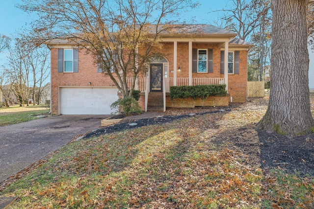 view of front of home featuring a garage and covered porch