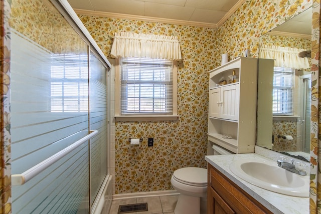 full bathroom featuring toilet, vanity, crown molding, and a healthy amount of sunlight