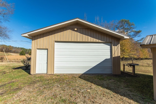 garage featuring a yard