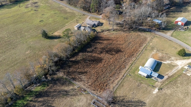 birds eye view of property with a rural view