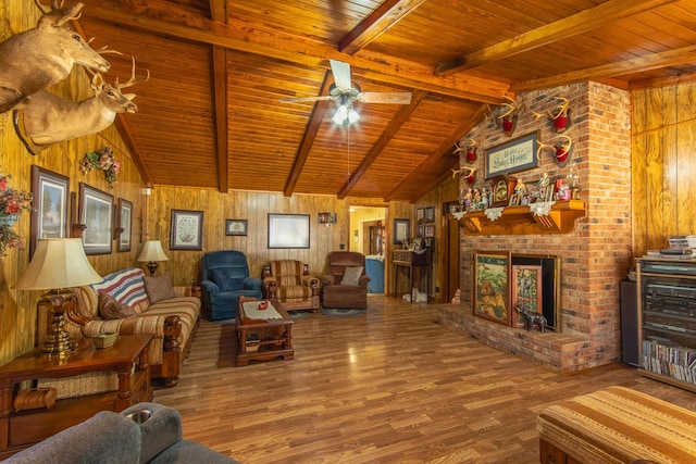 living room with vaulted ceiling with beams, wooden walls, a fireplace, wood ceiling, and hardwood / wood-style flooring