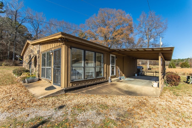 view of side of home featuring a carport