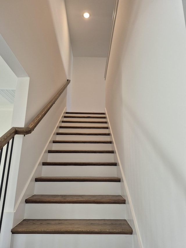 stairway featuring recessed lighting and baseboards