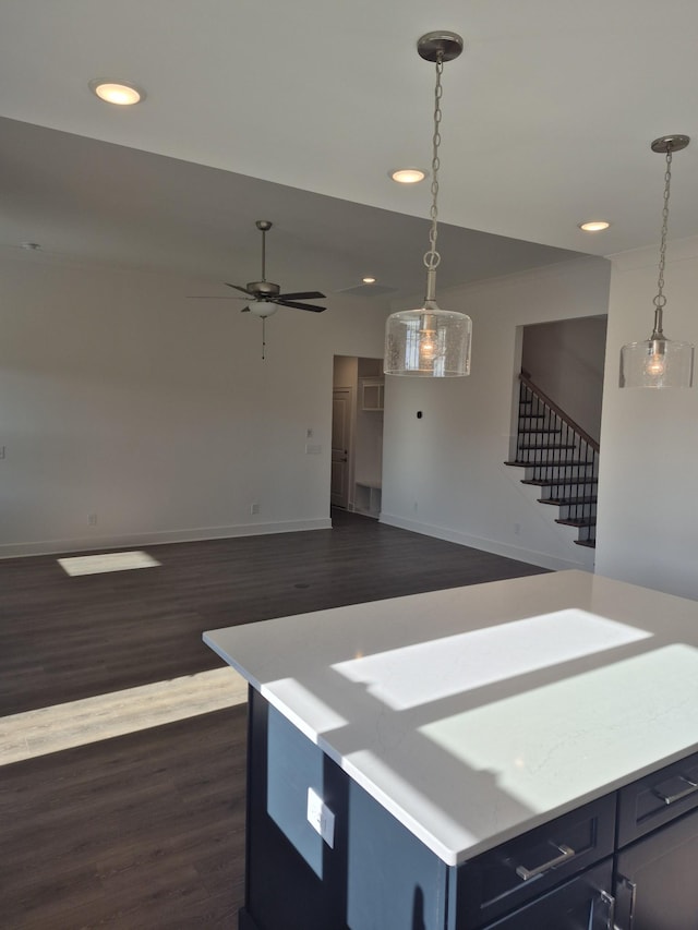 kitchen featuring baseboards, ceiling fan, dark wood-style flooring, decorative light fixtures, and recessed lighting