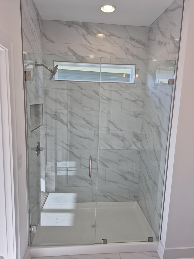 full bath featuring a healthy amount of sunlight, a stall shower, and recessed lighting