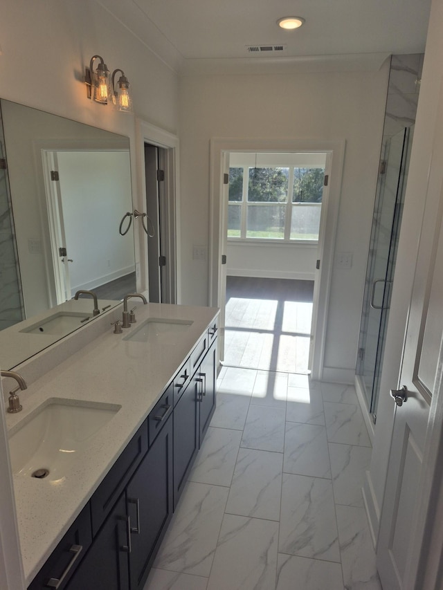 full bathroom featuring marble finish floor, visible vents, and a sink