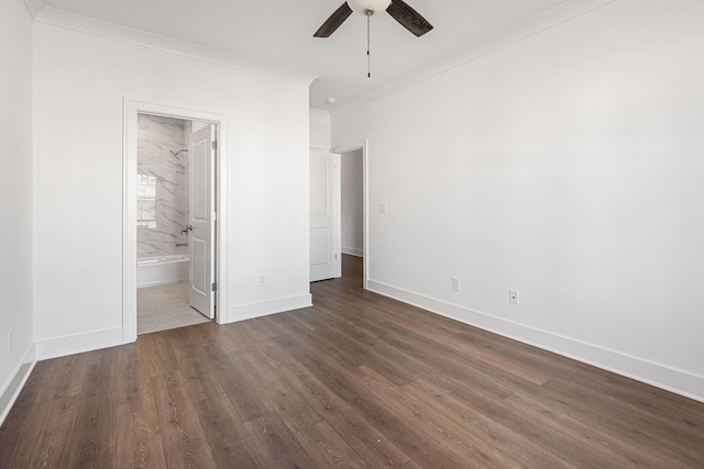 unfurnished bedroom with baseboards, a ceiling fan, connected bathroom, ornamental molding, and dark wood-style flooring