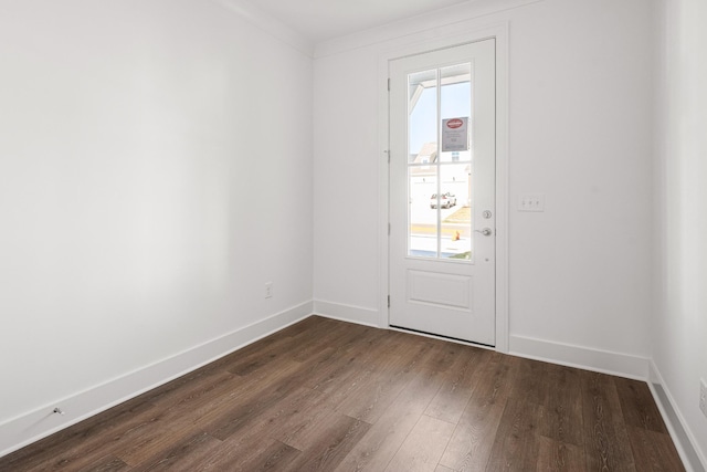 doorway to outside featuring dark wood-type flooring and baseboards