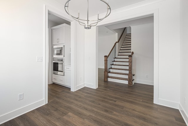 unfurnished dining area featuring stairway, baseboards, a chandelier, and dark wood finished floors