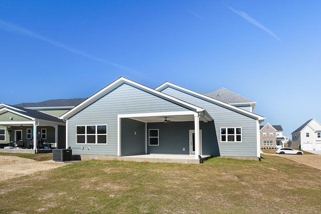 back of house with a patio area, a lawn, central AC unit, and a ceiling fan