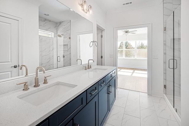 full bath featuring marble finish floor, visible vents, a sink, and a marble finish shower