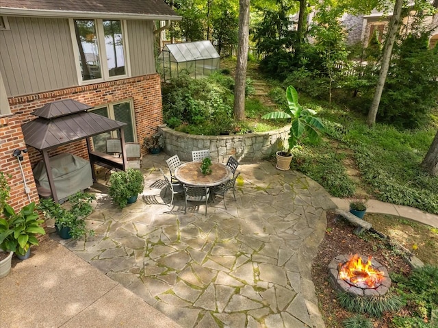 view of patio featuring an outbuilding