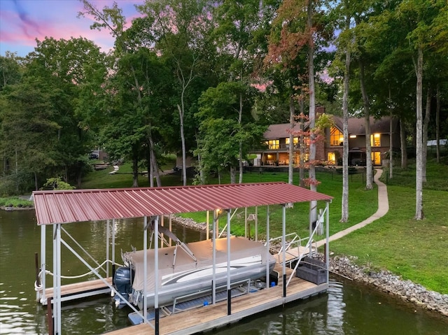 view of dock featuring a water view and a yard