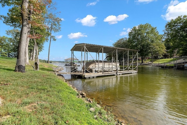 dock area featuring a yard and a water view