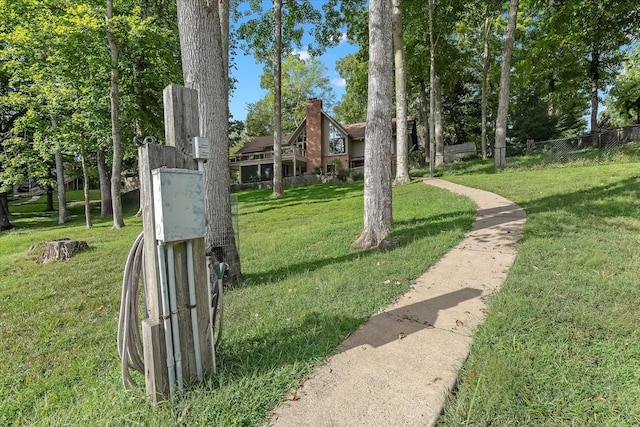 view of home's community with a lawn