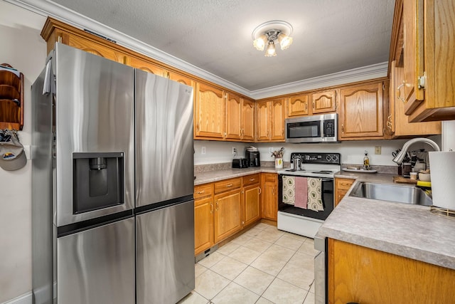 kitchen featuring crown molding, sink, a textured ceiling, and appliances with stainless steel finishes