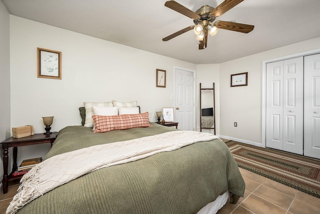 tiled bedroom with a closet and ceiling fan