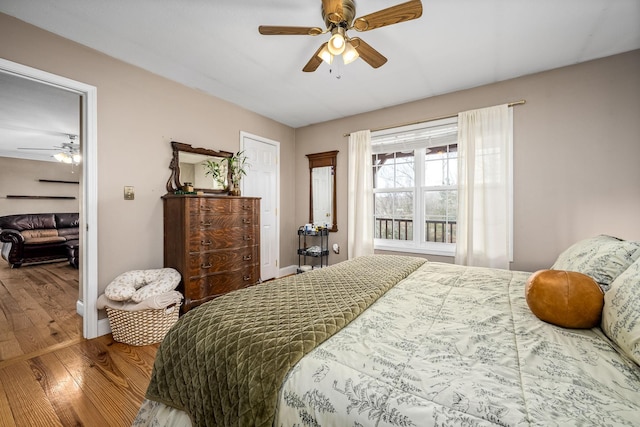 bedroom featuring ceiling fan and wood-type flooring