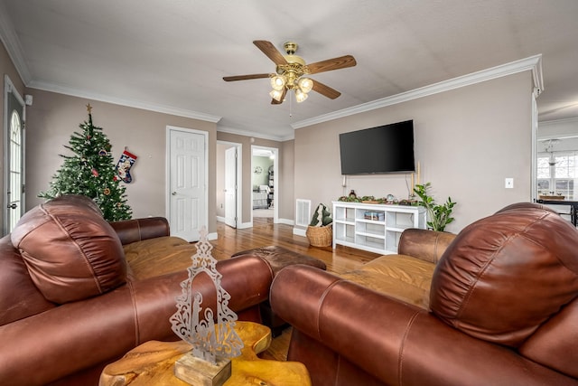 living room with ceiling fan, hardwood / wood-style floors, and ornamental molding