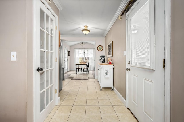 doorway with light tile patterned floors, french doors, ceiling fan, and ornamental molding