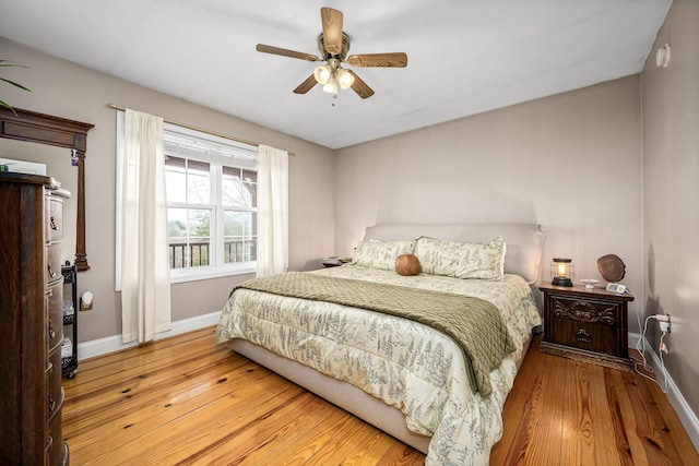 bedroom featuring ceiling fan and light hardwood / wood-style floors