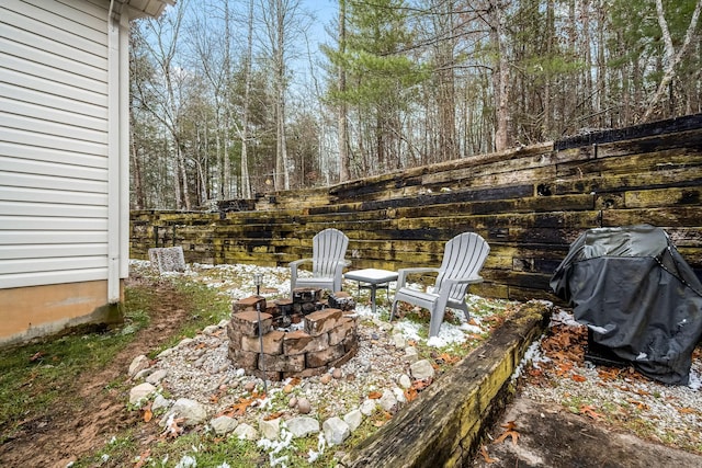 view of patio with a fire pit and a grill