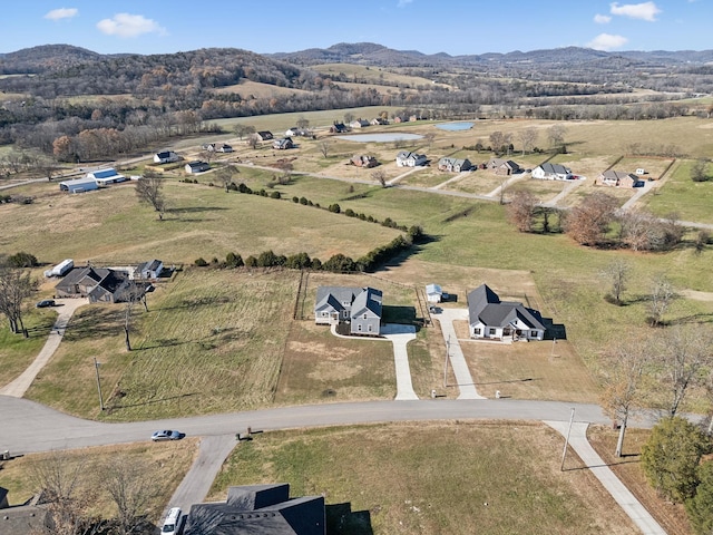 bird's eye view featuring a mountain view and a rural view