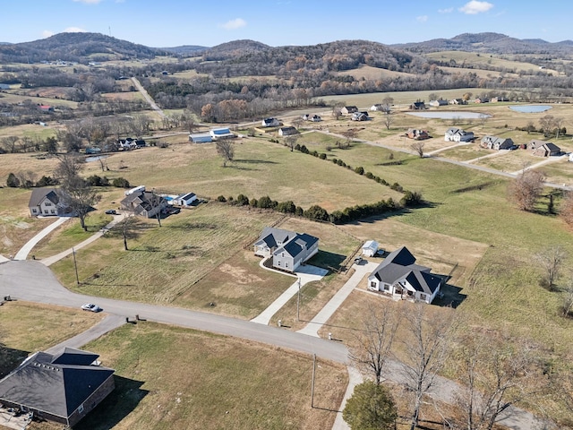 drone / aerial view with a mountain view and a rural view