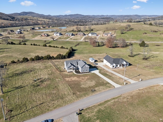 aerial view with a mountain view and a rural view