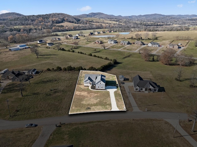 bird's eye view featuring a mountain view and a rural view